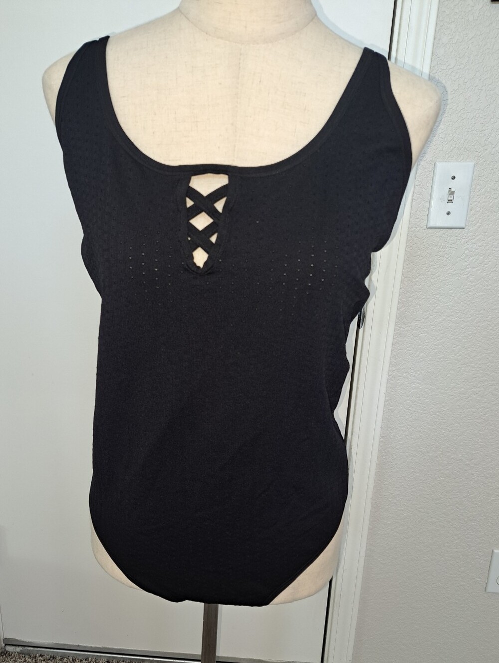 Black sleeveless fitted layering bodysuit